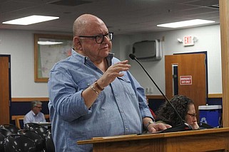 Larry Perkin, a partner with the Rogers-based architecture firm Hight Jackson Associates, speaks during a presentation on the programming and conceptual cost estimate for a proposed expansion of Benton County's Juvenile Justice Center and Juvenile Detention Center during the Benton County Quorum Court meeting Thursday.
(NWA Democrat-Gazette/Thomas Saccente)